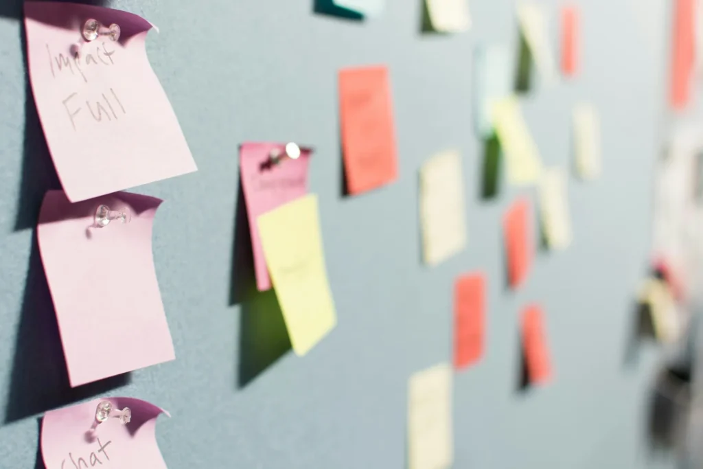Colourful sticky notes pinned to a board while planning topics